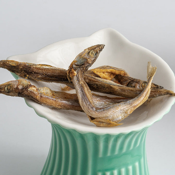 White bowl on green pedestal base