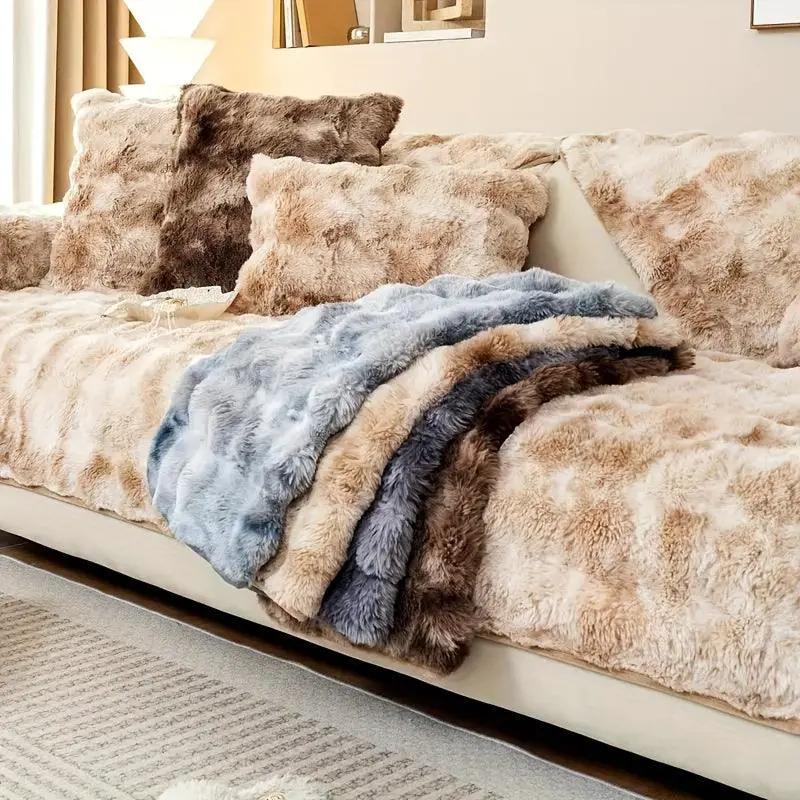 Luxurious gradient velvet sofa cover on beige-tan sofa with a blue-gray faux fur throw