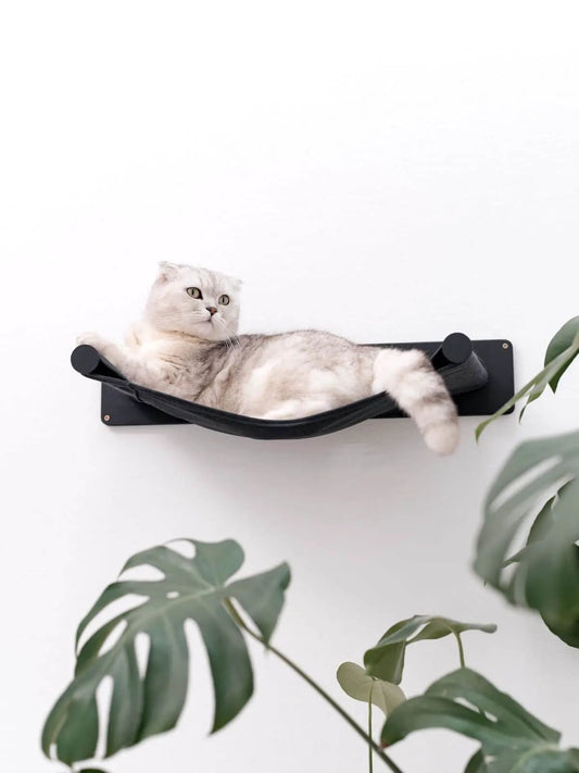 Cat Hammock Shelf by Enjoy The Wood B2B; black fabric hammock mounted on a wall plate.