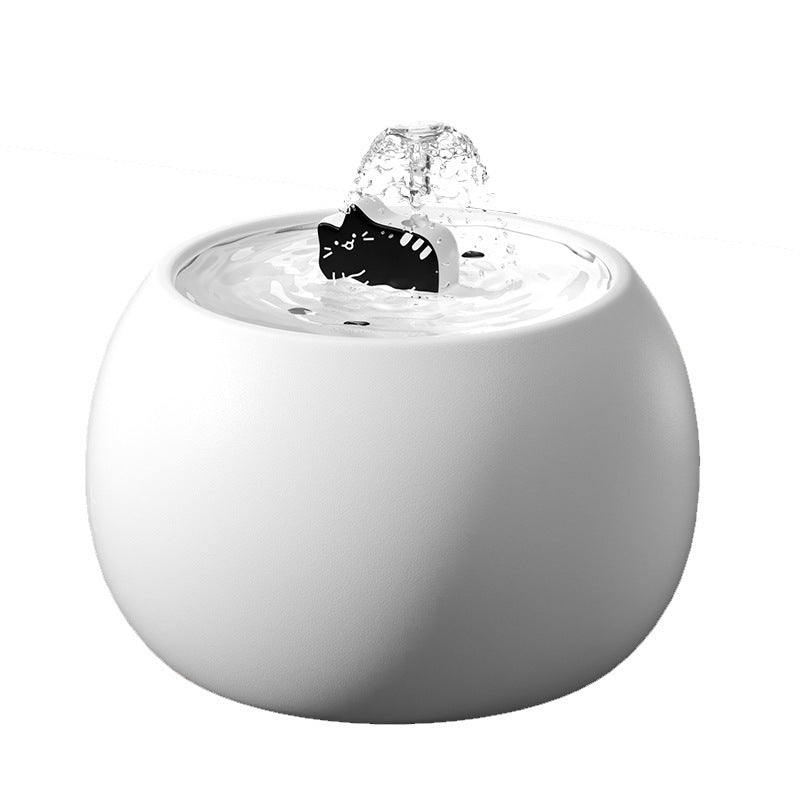 White ceramic cat fountain on a plain background