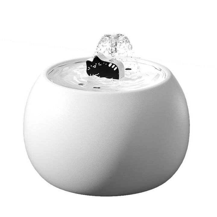 White ceramic cat fountain on a plain background