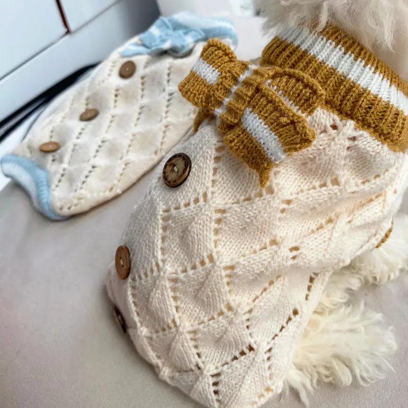 Pet Zen hollow-out knitted dog sweater in cream with diamond pattern, brown buttons, and mustard-striped bow