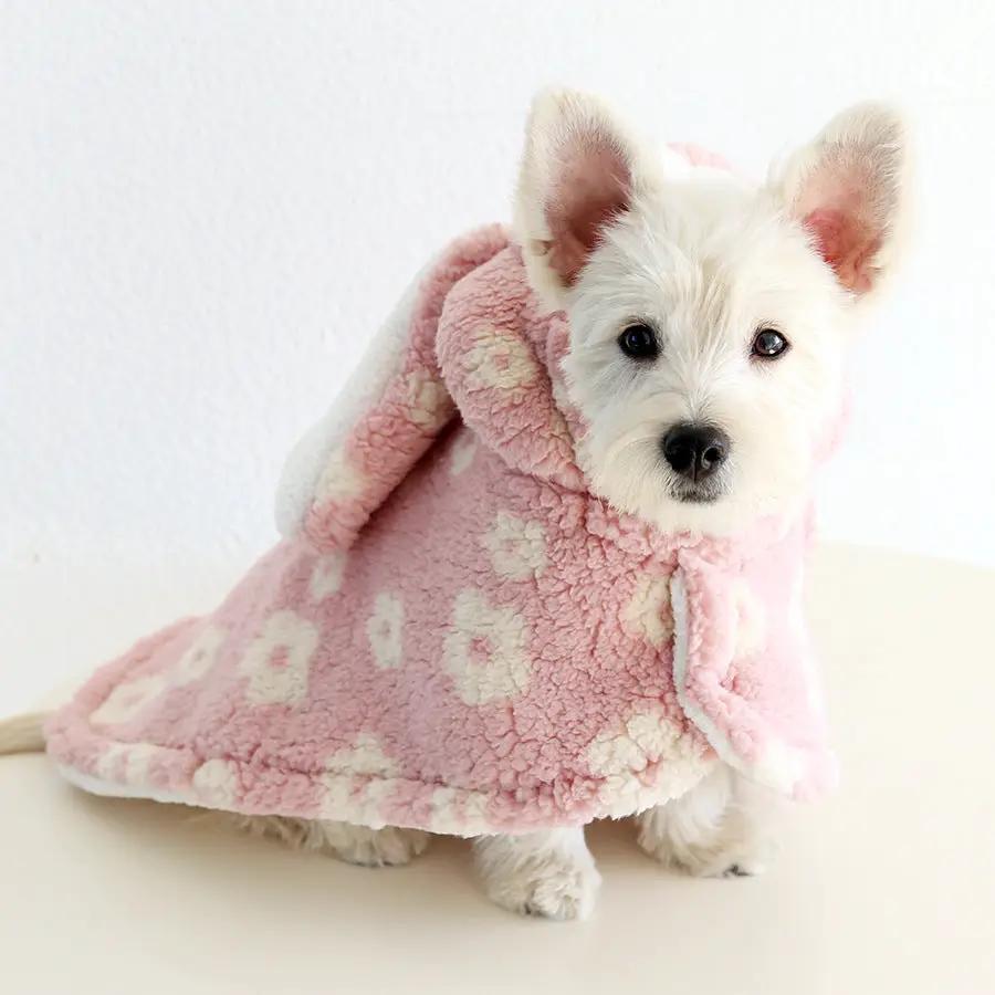 Small dog flannel cape towel in pink with white floral pattern.