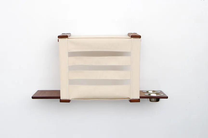 Deluxe Cat Cubby Bed; beige fabric cubby with wooden shelves and stainless bowls.