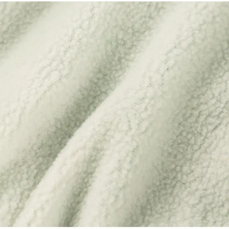 Dog clothes pale green fleece fabric swatch with soft plush texture