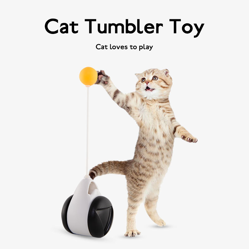 Cat reaching up to bat the yellow ball on a black-and-white Orbit Wobble Cat Toy