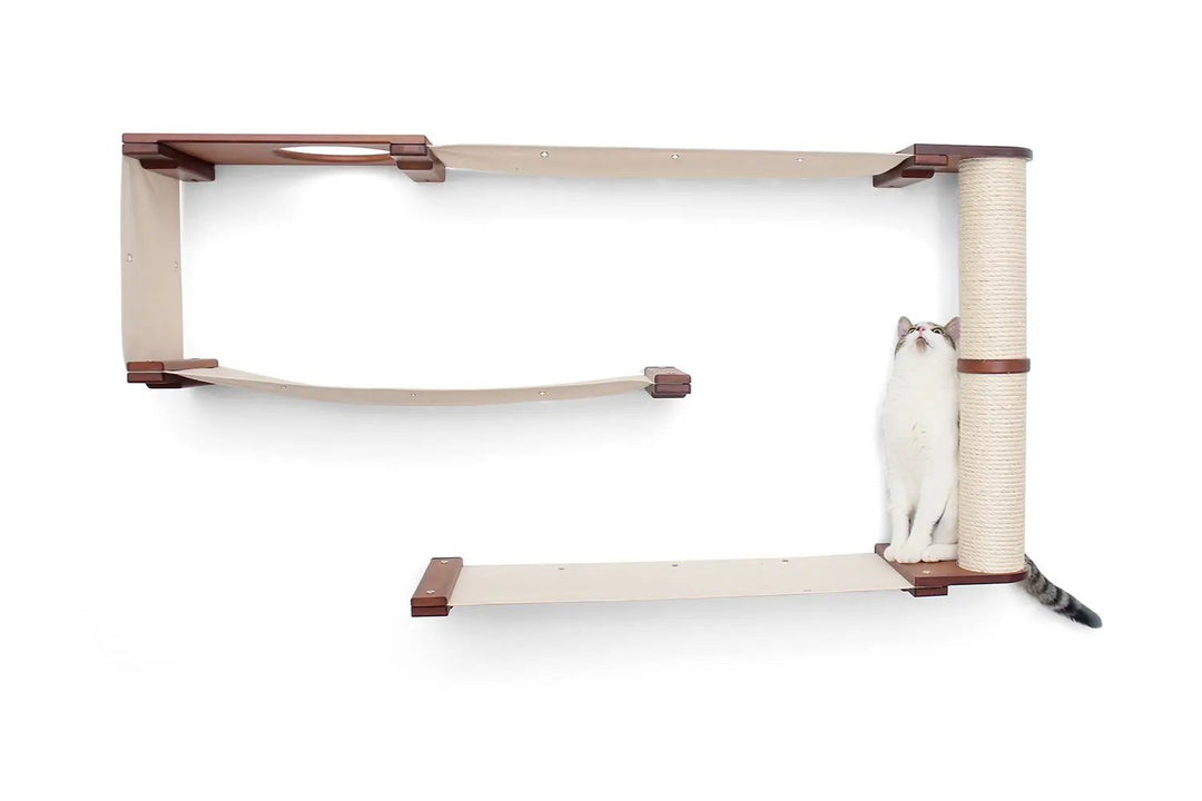 Cat Maze Wall 3-Tier Cat Tree; beige fabric platforms with brown ends and a sisal-wrapped post, cat beside.