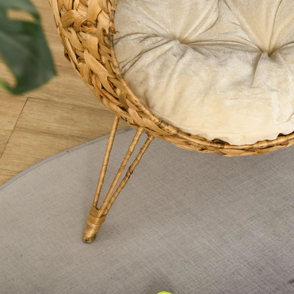 Cozy elevated cat bed by Doba; handcrafted woven brown rattan condo with a soft beige cushion