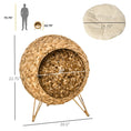 Load image into Gallery viewer, Cozy Elevated Cat Bed, handcrafted round woven cat condo with beige cushion in natural brown fibers.
