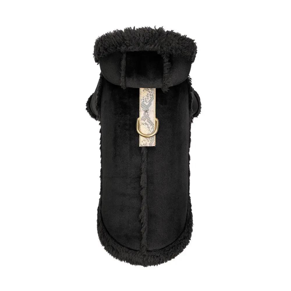 Black sheepskin dog coat with plush shearling trim and beige patterned strap with gold D-ring