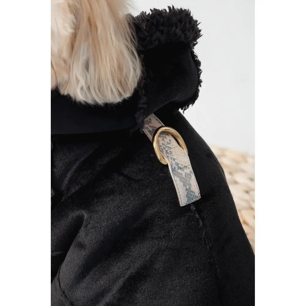 Sheepskin coat for dogs with black plush exterior and fur collar; patterned strap with gold D-ring