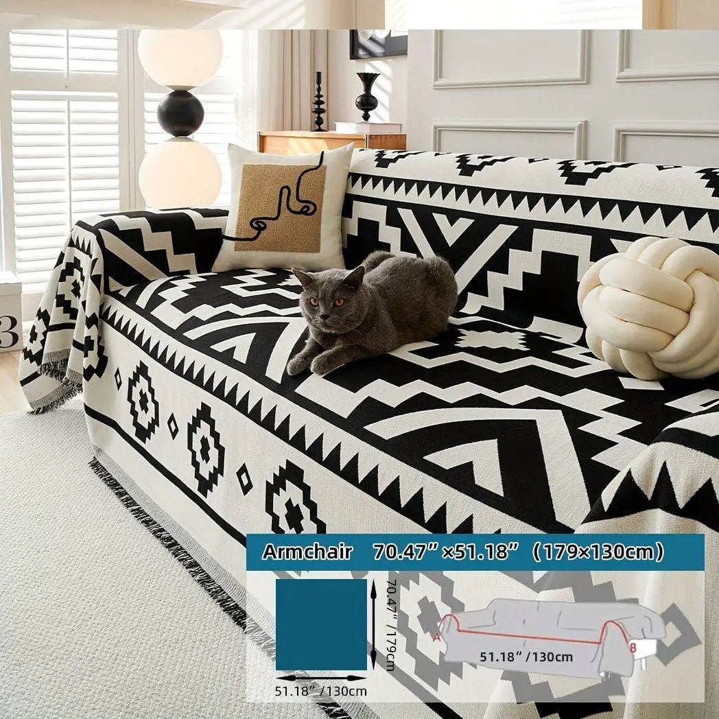 Boho-Chic all-season sofa cover on a sofa with a cat, black-and-white geometric pattern and pet-proof design