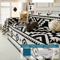 Load image into Gallery viewer, Boho-Chic all-season sofa cover on a sofa with a cat, black-and-white geometric pattern and pet-proof design
