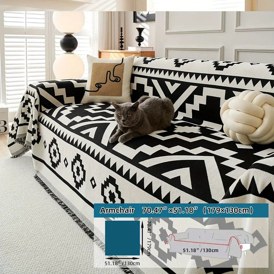 Boho-Chic all-season sofa cover on a sofa with a cat, black-and-white geometric pattern and pet-proof design