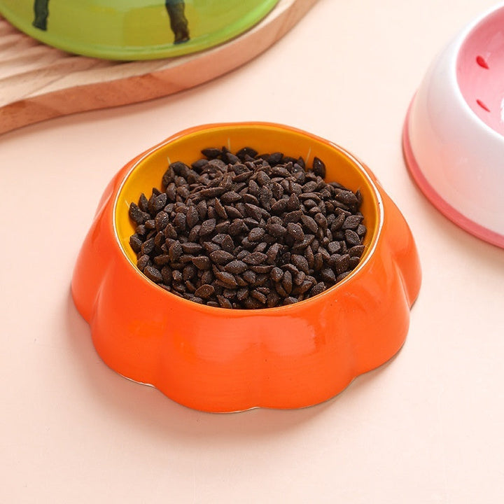 Pumpkin ceramic bowl filled with food