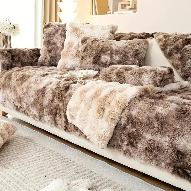 Luxurious gradient velvet sofa cover on a white sofa with multiple beige-brown plush cushions