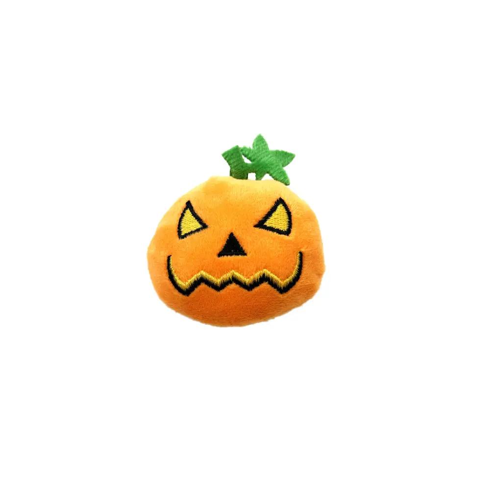 Pumpkin jack-o'-lantern plush cat toy, orange with green stem, soft fabric.