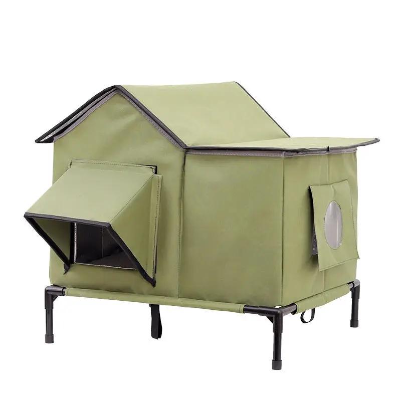 Pet Zen outdoor cat bed in olive green fabric on a metal frame with rooftop shelter for winter warmth and side windows.