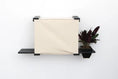 Carica l'immagine nel visualizzatore della galleria, Deluxe Cat Cubby Bed by Catastrophic Creations on a wall-mounted shelf, beige fabric, black frame
