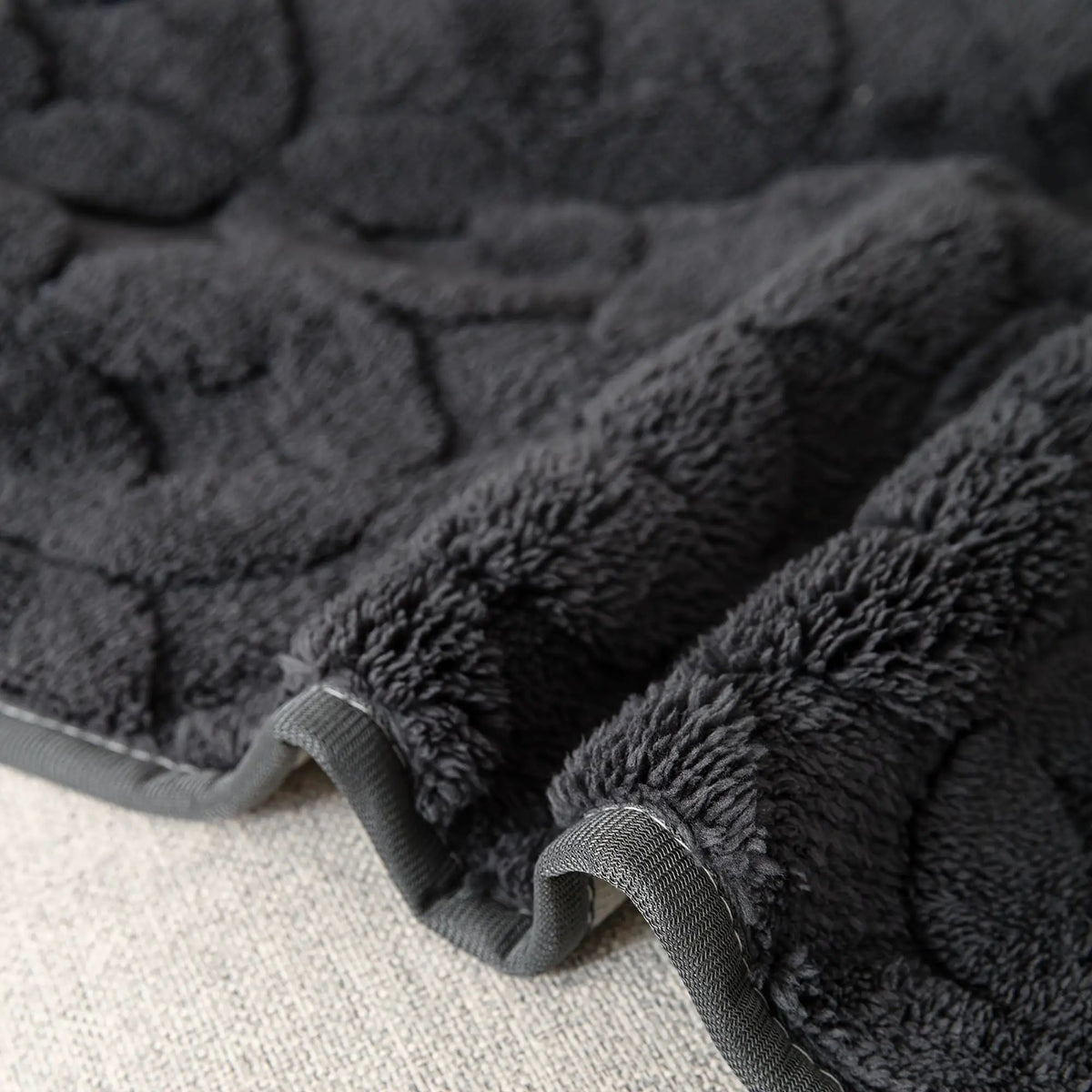 L-shaped couch cover by topspet, dark gray fabric with securing straps