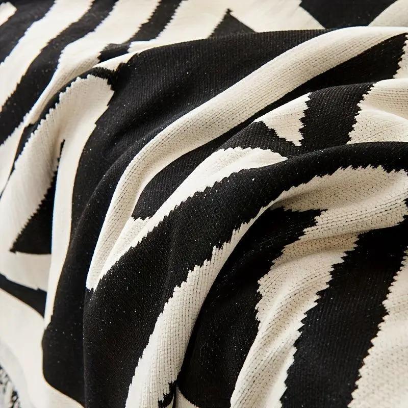Bohemian-style chenille couch cover in black and white chevron pattern, extra-long