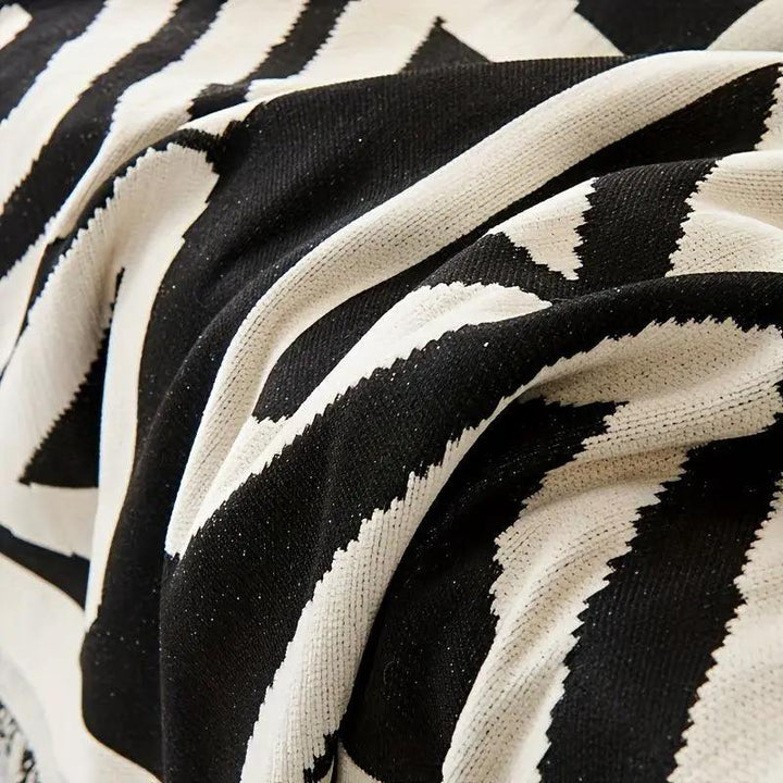 Bohemian-style chenille couch cover in black and white chevron pattern, extra-long