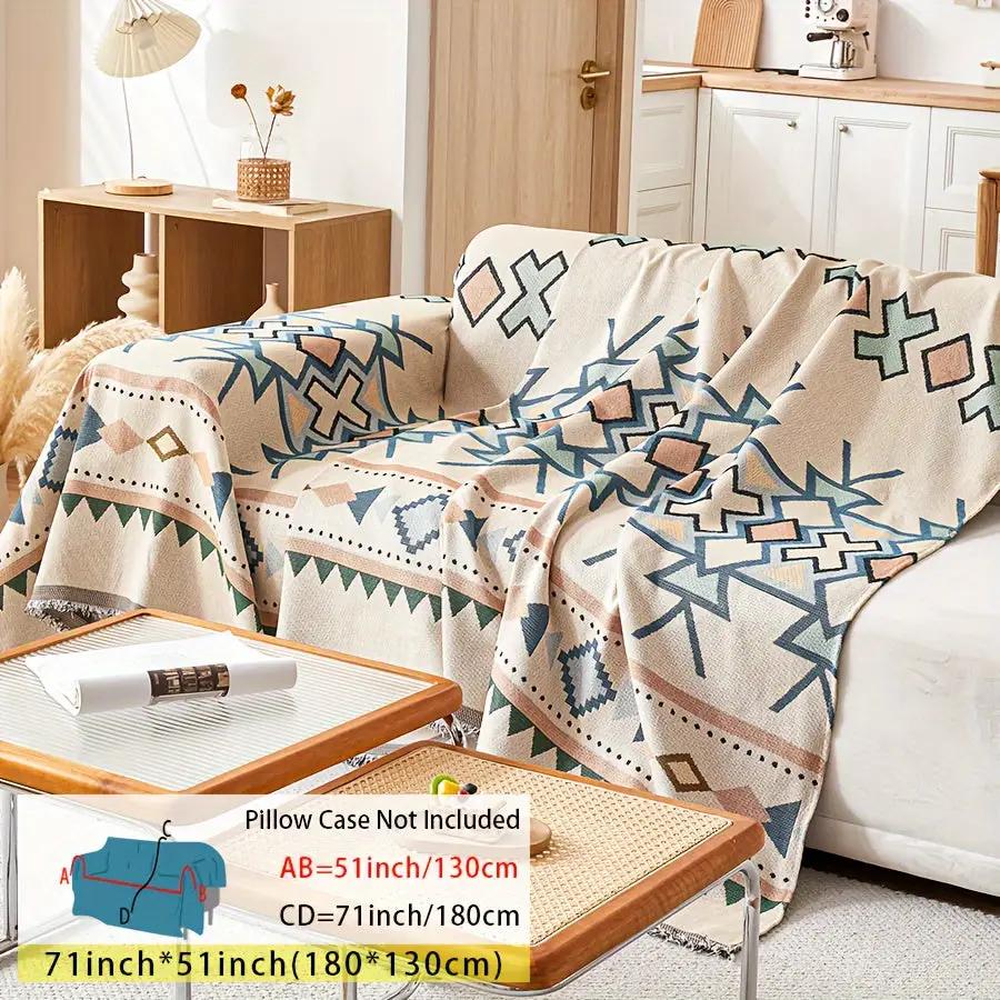 Extra Large Sofa Cover by topspet; stretchable furniture protector in beige with blue and brown geometric pattern.