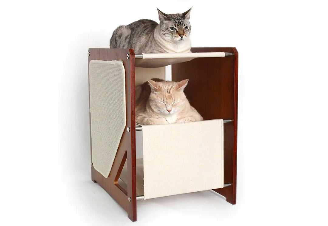 The Grotto cat condo with wood frame and beige panels; two cats lounging inside.