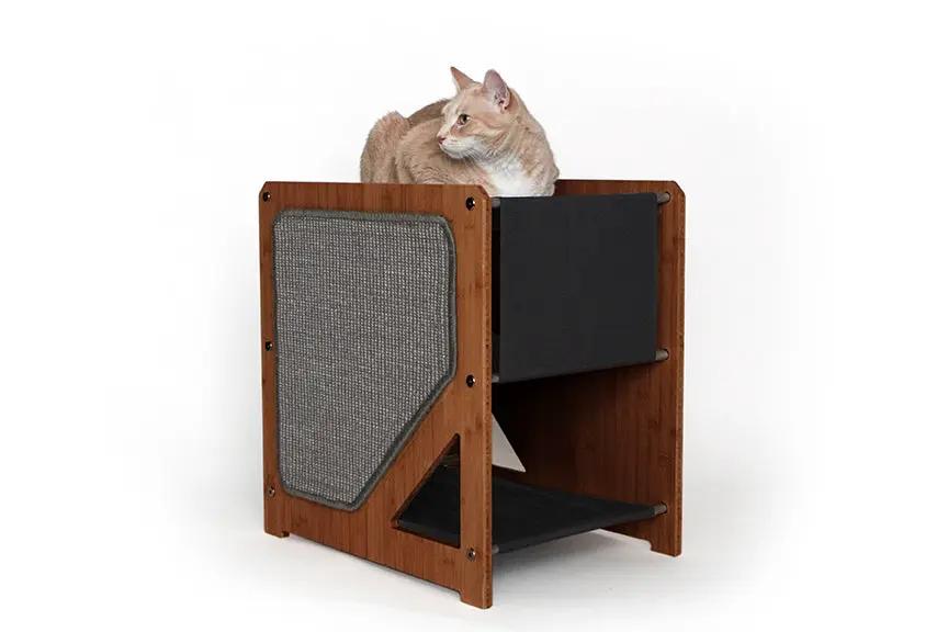 The Grotto short cat condo for small spaces in wood finish with gray scratching panel and lower shelf