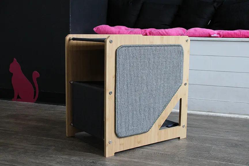 The Grotto Cat Condo by Catastrophic Creations, compact wooden frame with gray fabric panel.