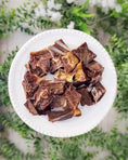 Load image into Gallery viewer, Goat Cubes, bone-in, free-range, served on a white plate.
