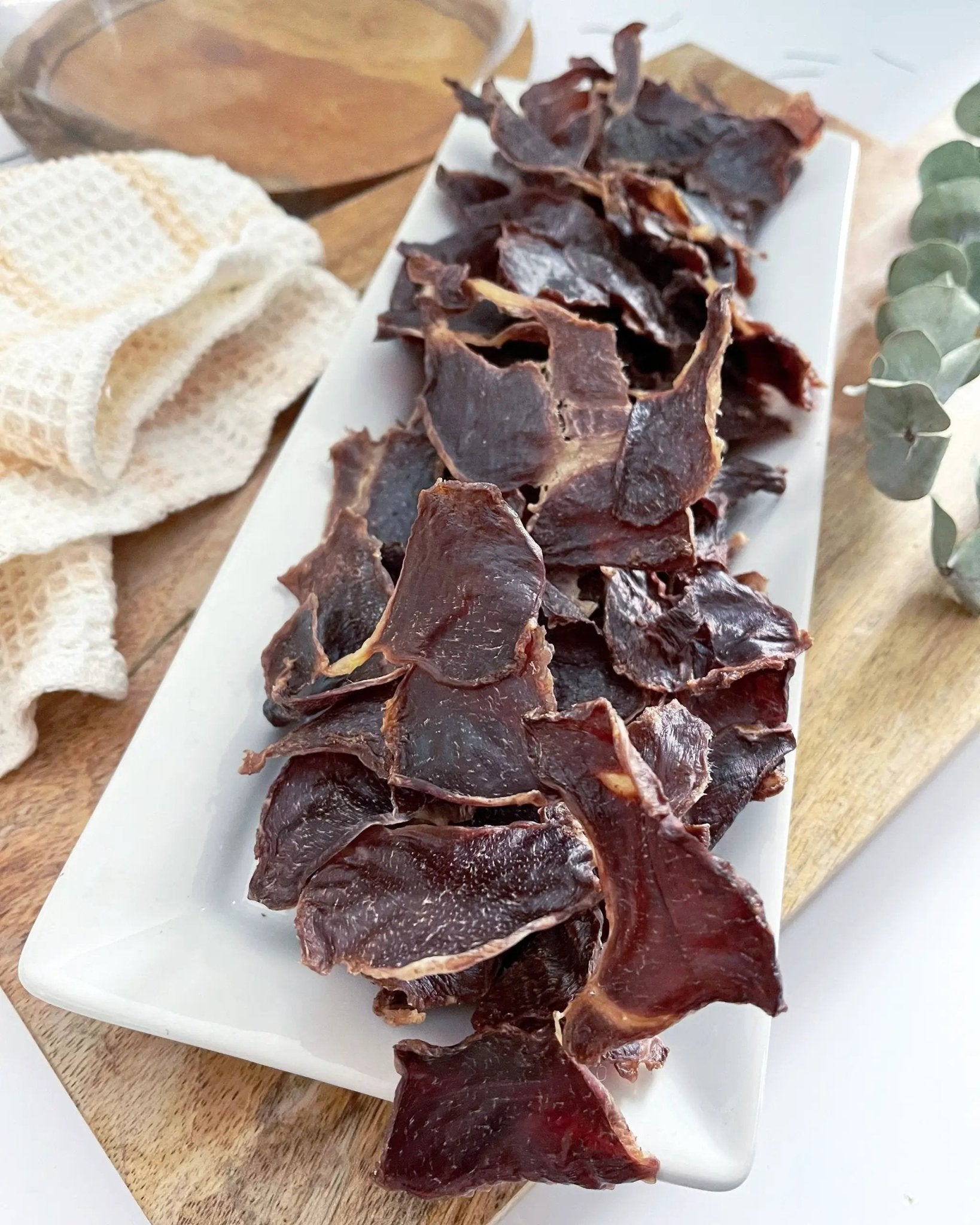 Naked Beasts turkey gizzard ABF thin-cut slices on a white platter