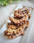 Load image into Gallery viewer, Naked Beasts chicken necks, bone-in and crispy roasted, on a white rectangular platter (5 pieces)
