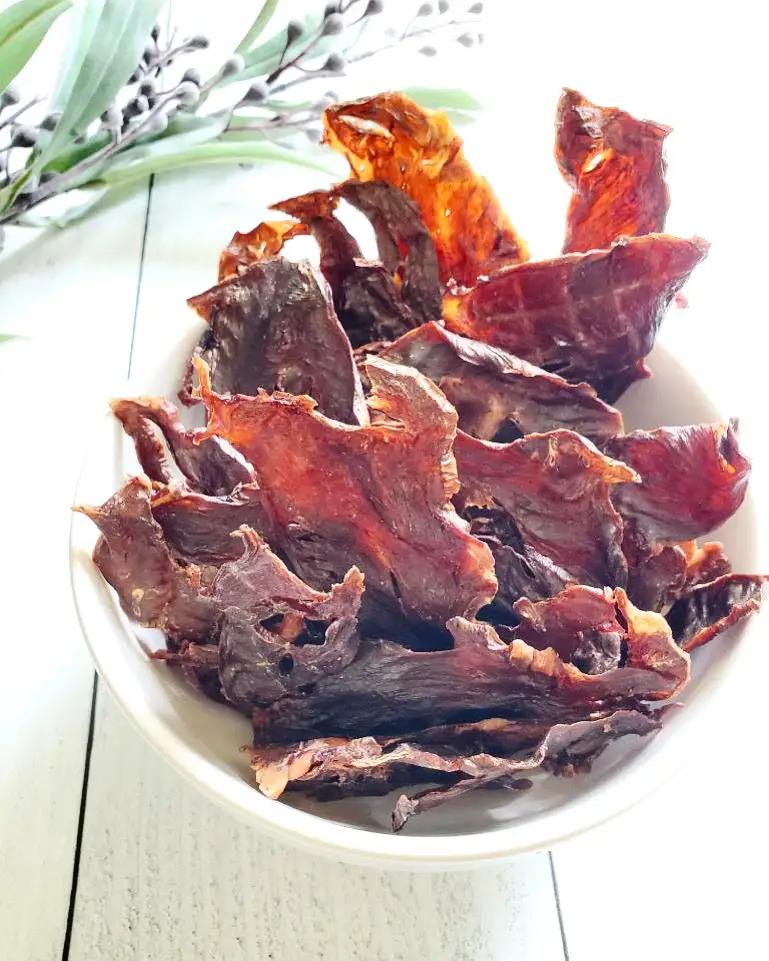 Pork heart thin-cut slices, fat trimmed, in a white bowl; Naked Beasts