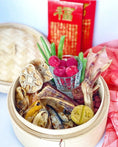 Load image into Gallery viewer, Green Lipped Mussels small animal treats by Naked Beasts in a bamboo steamer with dried morsels

