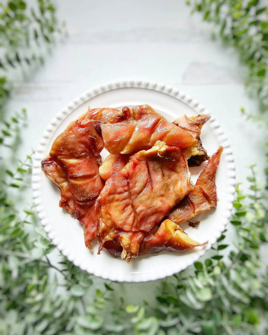 Pig Snout jerky pieces by Naked Beasts on a white plate