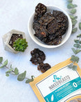 Load image into Gallery viewer, Turkey Liver small animal treats by Naked Beasts in a white bowl with dark dried liver chunks
