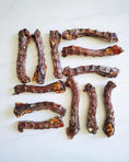 Load image into Gallery viewer, Duck Necks by Naked Beasts, brown dried dog treats, 12 pieces on white background
