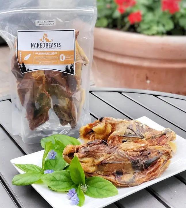 Chicken Frames (Chunked) by Naked Beasts in a clear bag, plated with basil garnish.