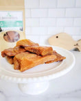 Carica l'immagine nel visualizzatore della galleria, Salmon fillet pieces on a white cake stand, Naked Beasts brand
