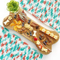 Load image into Gallery viewer, Mahi Mahi dog treats by Naked Beasts, wild-caught, presented on a wooden board with bite-sized chews
