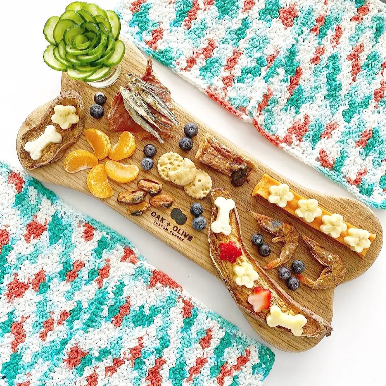 Mahi Mahi dog treats by Naked Beasts, wild-caught, presented on a wooden board with bite-sized chews