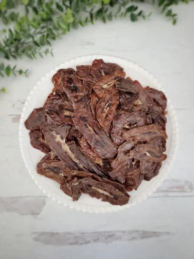 Pork Kidney Thin Cut by Naked Beasts - small animal treats, dried brown slices on plate
