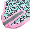 Cargar la imagen en la vista de la galería, Jeffers Expression 600D waterproof ripstop dog coat; turquoise with pink leopard print, pink trim, gray reflective strap.
