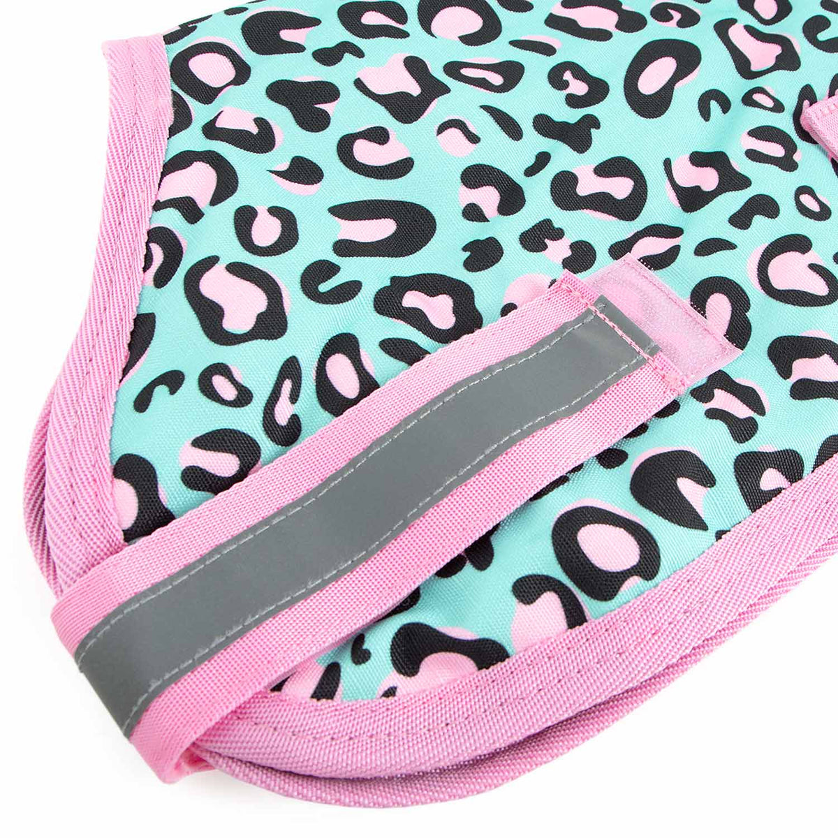 Jeffers Expression 600D waterproof ripstop dog coat; turquoise with pink leopard print, pink trim, gray reflective strap.