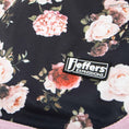Cargar la imagen en la vista de la galería, Jeffers Expressions dog coat with pink floral pattern on dark fabric and brand label
