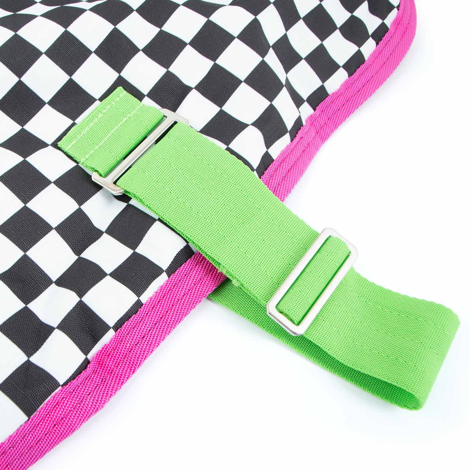 Jeffers Expression 600D waterproof ripstop dog coat with neon-green strap and pink trim on checkered fabric.