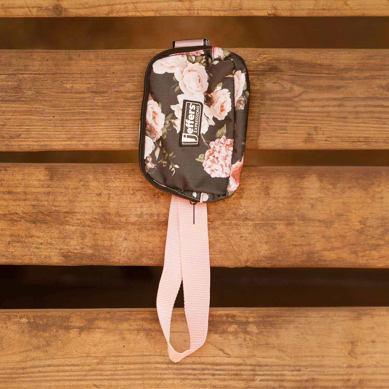 Jeffers Expression adjustable strap belt bag with black floral print and pink strap