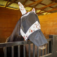 Load image into Gallery viewer, Jeffers Expression Deluxe mesh horse fly mask with ears and nose; white floral and black fabric on a horse in a stall.
