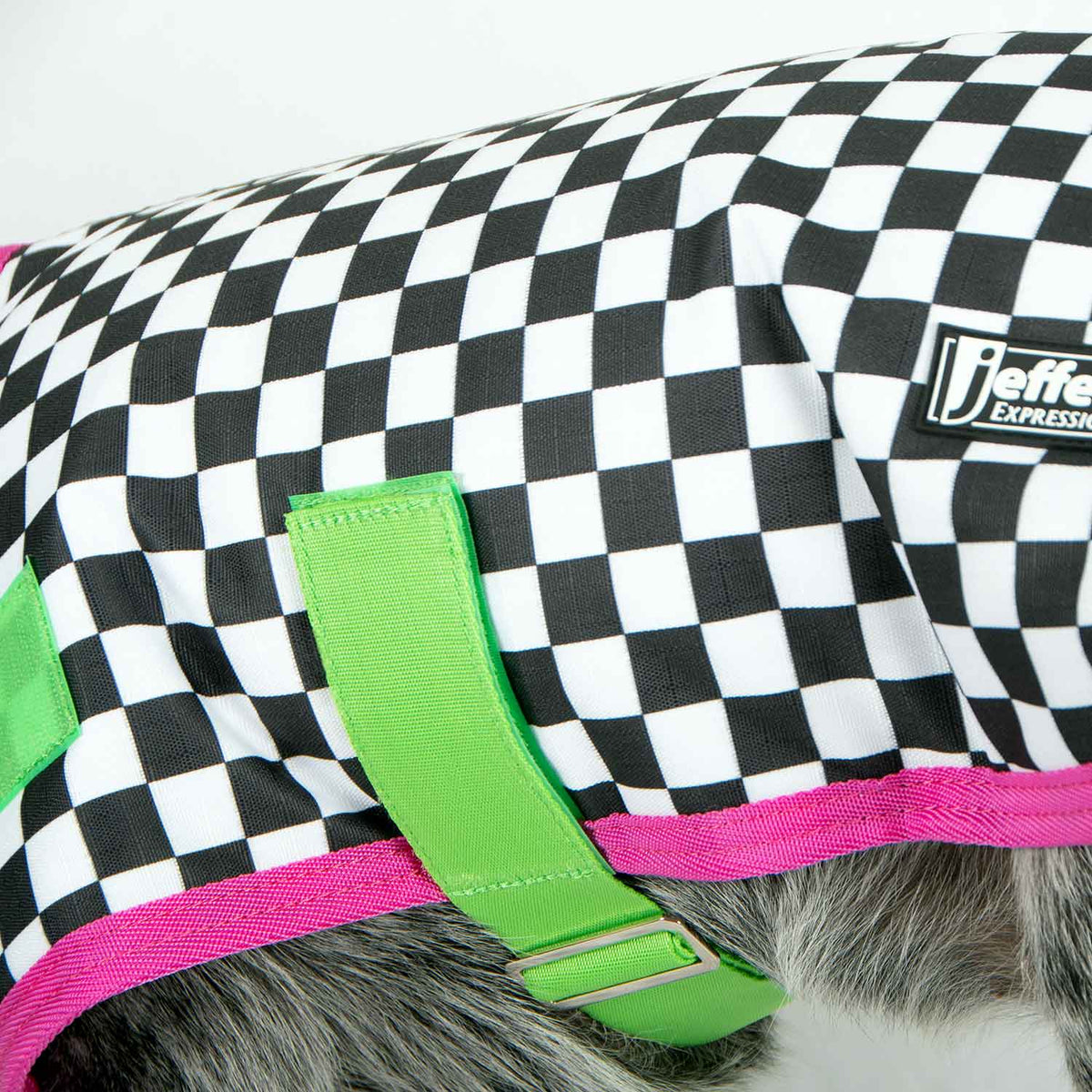 Jeffers Expression 600D Waterproof Ripstop Dog Coat; black-and-white checker fabric with neon green straps and pink trim.